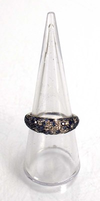 Lot 674 - A 14ct white gold bombe ring set small...