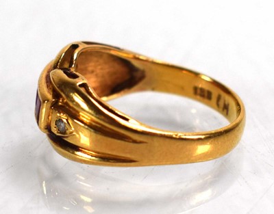 Lot 676 - An 18ct yellow gold ring set three square cut...