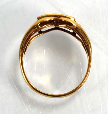 Lot 676 - An 18ct yellow gold ring set three square cut...