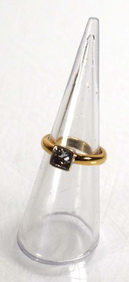 Lot 677 - A 9ct yellow gold ring set princess cut...