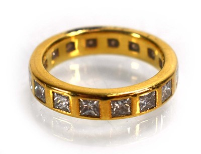 Lot 678 - A yellow metal full eternity ring set princess...