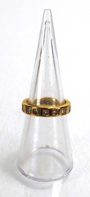 Lot 678 - A yellow metal full eternity ring set princess...