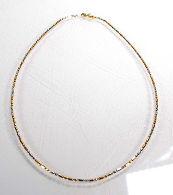 Lot 680 - A 14ct two colour gold bead type necklace, l....