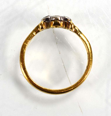Lot 686 - A 22ct yellow gold ring set four small...
