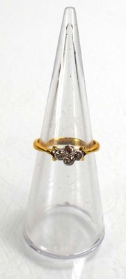 Lot 686 - A 22ct yellow gold ring set four small...