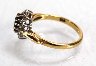 Lot 687 - A 9ct yellow gold sapphire and diamond cluster...