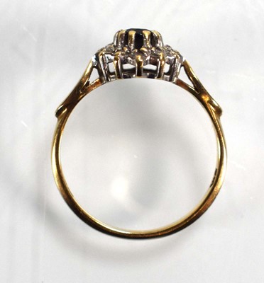 Lot 687 - A 9ct yellow gold sapphire and diamond cluster...