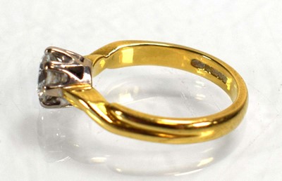 Lot 691 - An 18ct yellow gold ring set brilliant cut...