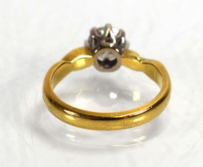 Lot 691 - An 18ct yellow gold ring set brilliant cut...