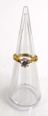 Lot 691 - An 18ct yellow gold ring set brilliant cut...