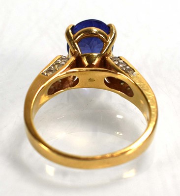 Lot 692 - A 14ct yellow gold ring set oval tanzanite in...