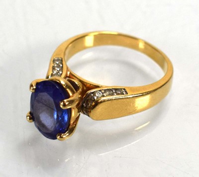 Lot 692 - A 14ct yellow gold ring set oval tanzanite in...