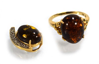 Lot 693 - A 14ct yellow gold ring set amber type stone...