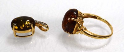 Lot 693 - A 14ct yellow gold ring set amber type stone...