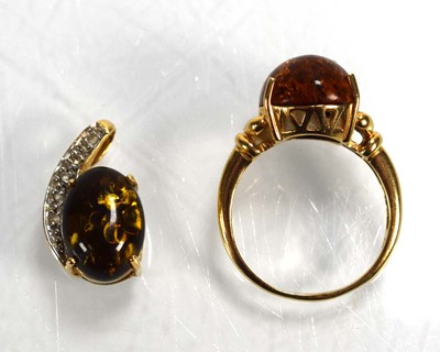 Lot 693 - A 14ct yellow gold ring set amber type stone...