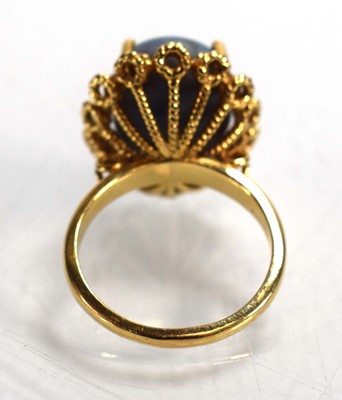 Lot 694 - A 14ct yellow gold ring set oval opal in a...