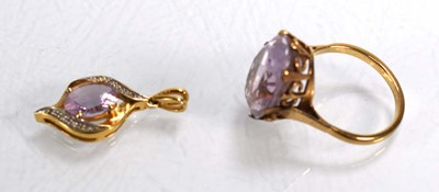 Lot 695 - A 9ct yellow gold ring set pale amethyst type...