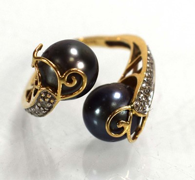 Lot 698 - A 14ct yellow gold crossover ring set Tahitian...