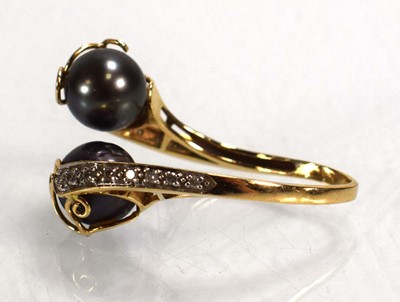 Lot 698 - A 14ct yellow gold crossover ring set Tahitian...