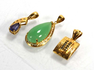 Lot 699 - Three 14ct yellow gold pendants set green...