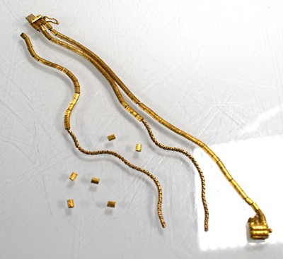 Lot 701 - An 18ct yellow gold triple strand engraved...