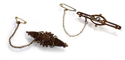 Lot 706 - A 9ct yellow gold bar brooch decorated in the...
