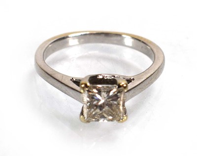 Lot 707 - An 18ct white gold ring set princess cut...