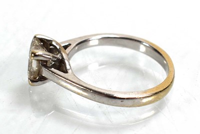 Lot 707 - An 18ct white gold ring set princess cut...