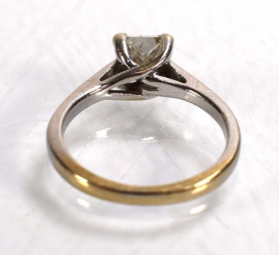Lot 707 - An 18ct white gold ring set princess cut...