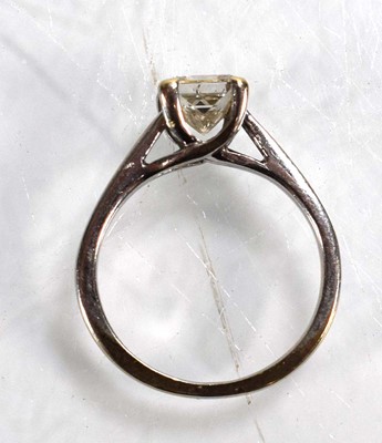 Lot 707 - An 18ct white gold ring set princess cut...