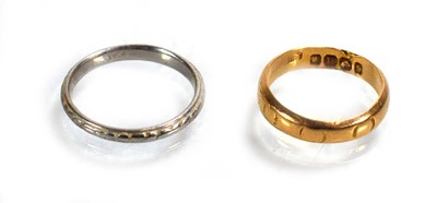 Lot 710 - A late Victorian 18ct yellow gold wedding band,...