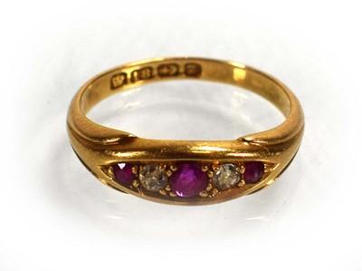 Lot 711 - An 18ct yellow gold ring set three graduated...