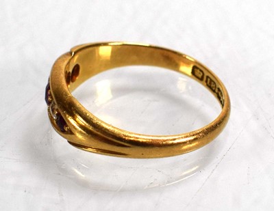 Lot 711 - An 18ct yellow gold ring set three graduated...