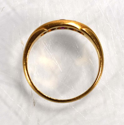 Lot 711 - An 18ct yellow gold ring set three graduated...