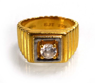 Lot 714 - A 22ct yellow gold signet ring set clear stone...