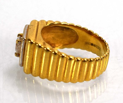 Lot 714 - A 22ct yellow gold signet ring set clear stone...
