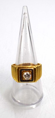 Lot 714 - A 22ct yellow gold signet ring set clear stone...