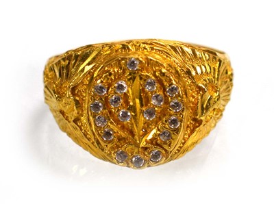 Lot 715 - A yellow metal signet ring set clear stones...