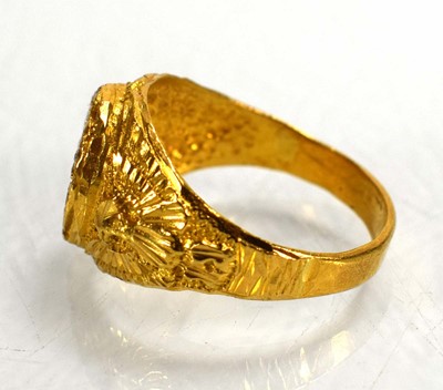 Lot 715 - A yellow metal signet ring set clear stones...