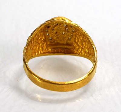 Lot 715 - A yellow metal signet ring set clear stones...