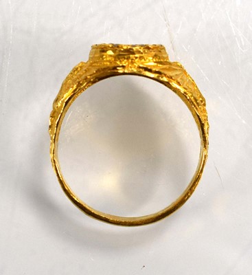 Lot 715 - A yellow metal signet ring set clear stones...