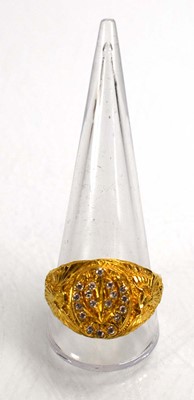Lot 715 - A yellow metal signet ring set clear stones...