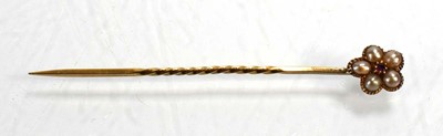 Lot 716 - A yellow metal stick pin set ruby and seed...