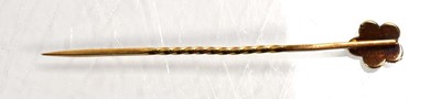 Lot 716 - A yellow metal stick pin set ruby and seed...