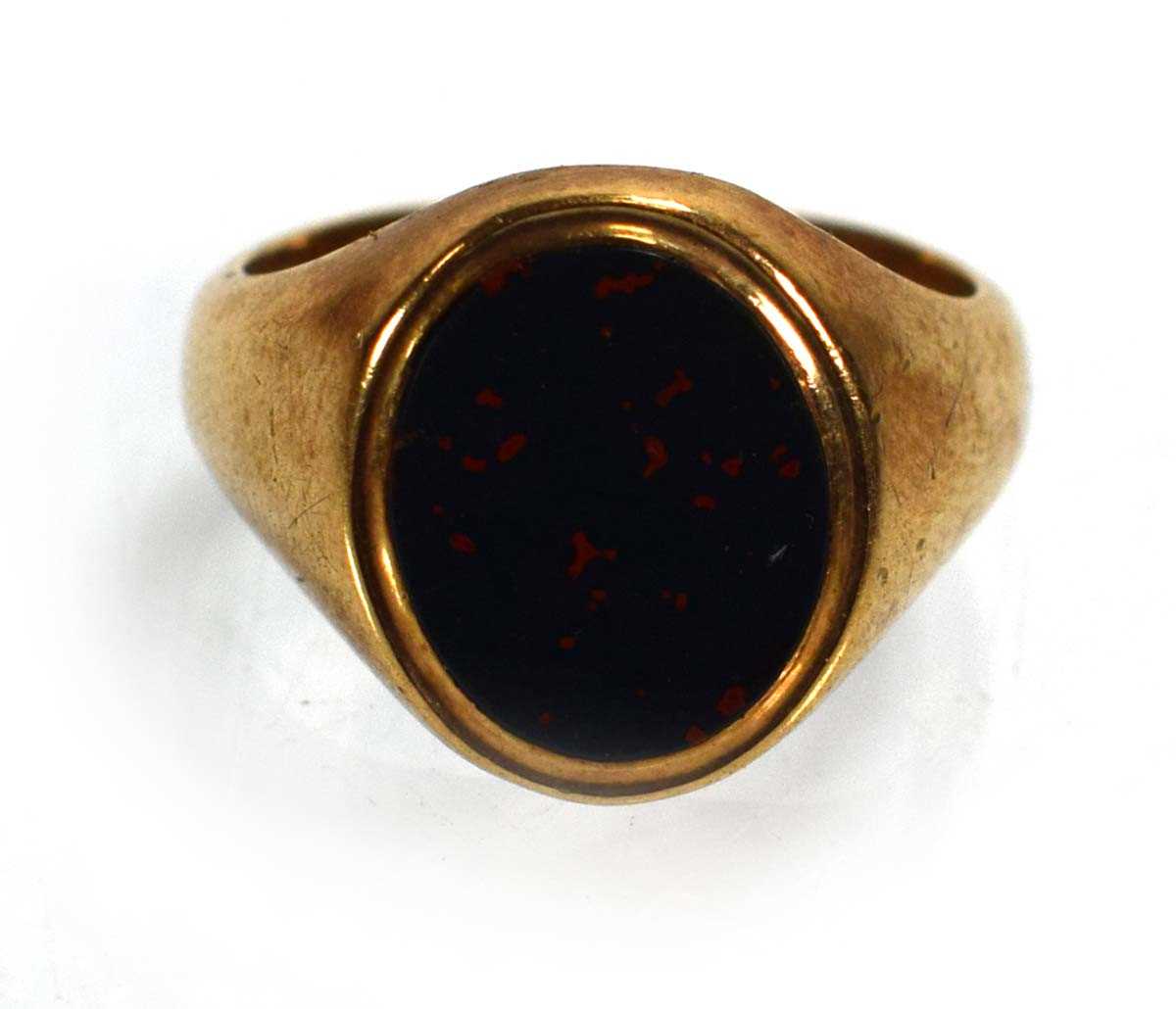 Lot 718 - A 9ct yellow gold signet ring set bloodstone,...