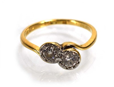 Lot 720 - An 18ct yellow gold crossover ring set two...
