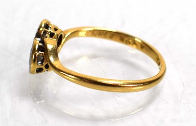 Lot 720 - An 18ct yellow gold crossover ring set two...