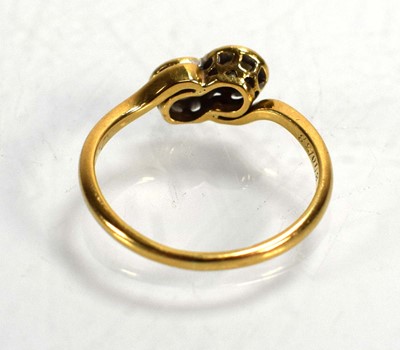 Lot 720 - An 18ct yellow gold crossover ring set two...