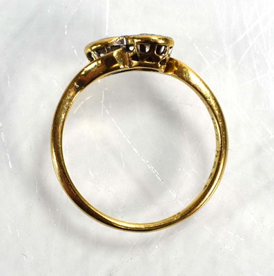 Lot 720 - An 18ct yellow gold crossover ring set two...