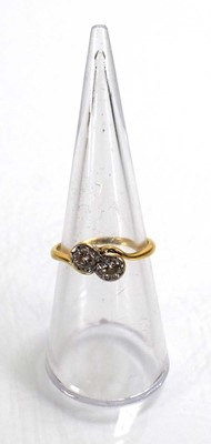 Lot 720 - An 18ct yellow gold crossover ring set two...